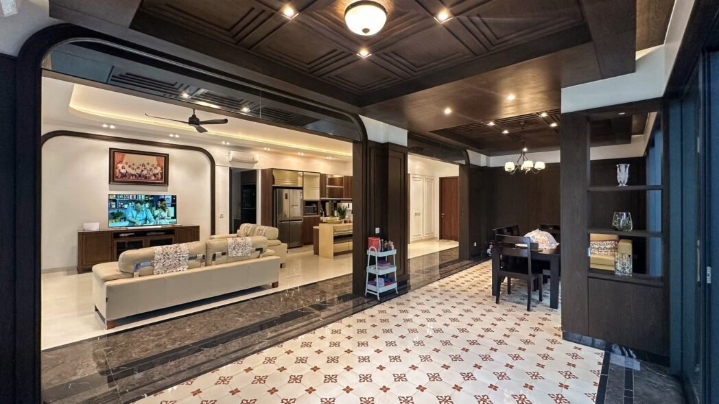 A luxurious Indochine-style house with elegant furnishings and soft lighting.