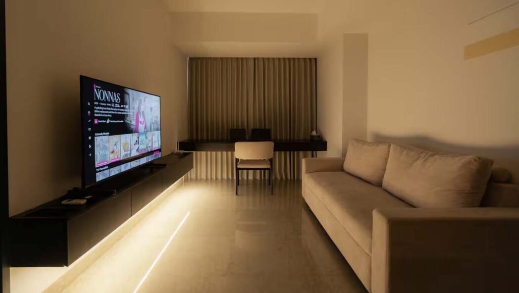 Spacious modern apartment living room in The Branz BSD with neutral tones.